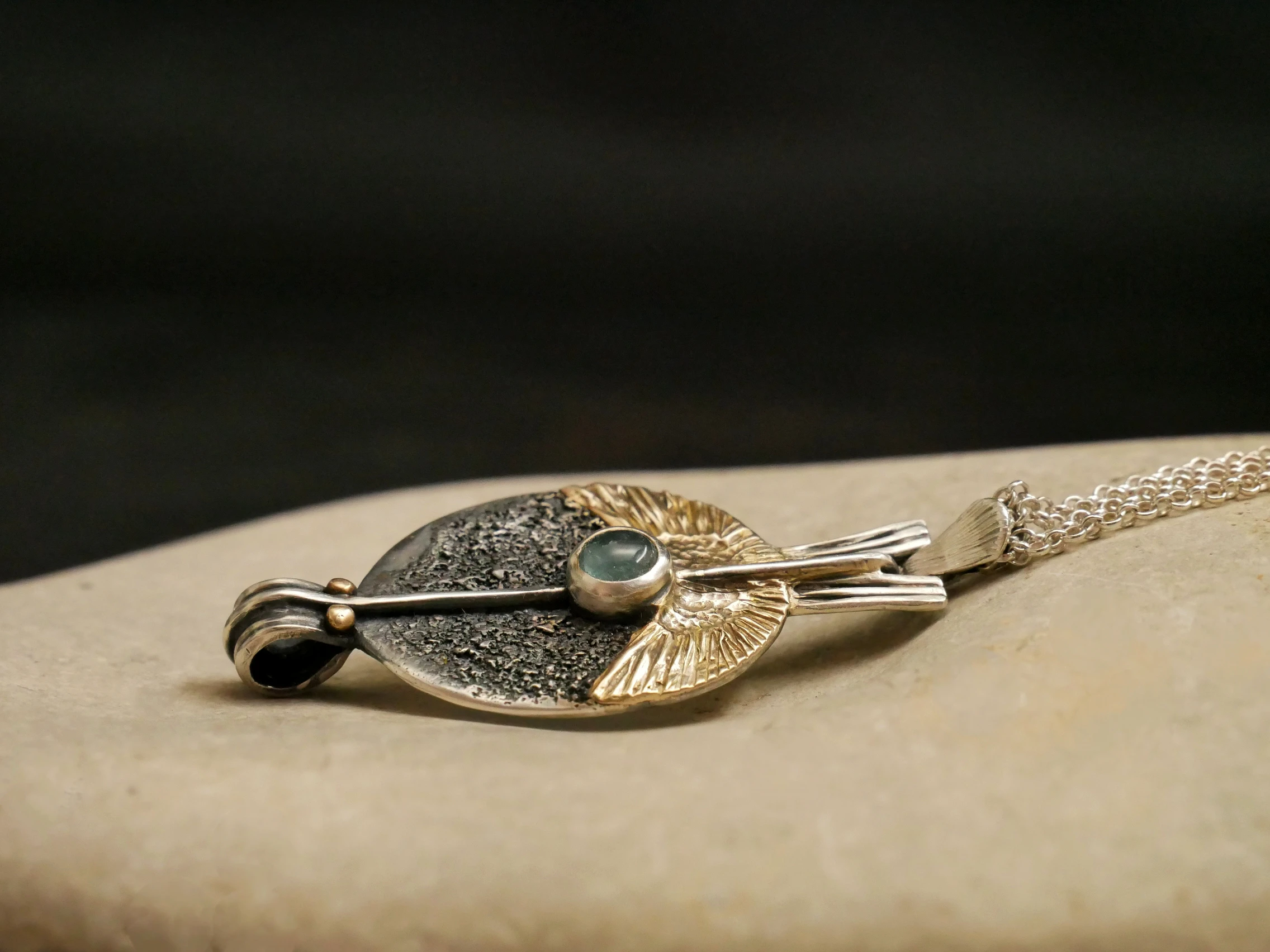 Eliz'art artisan pendant – sterling silver egg, spread 14k gold wings, vertical axis and blue tourmaline, unique creation Bordeaux